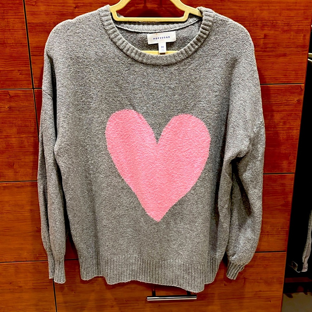 Cute, super soft and cozy sweater. Has some stretch, great condition